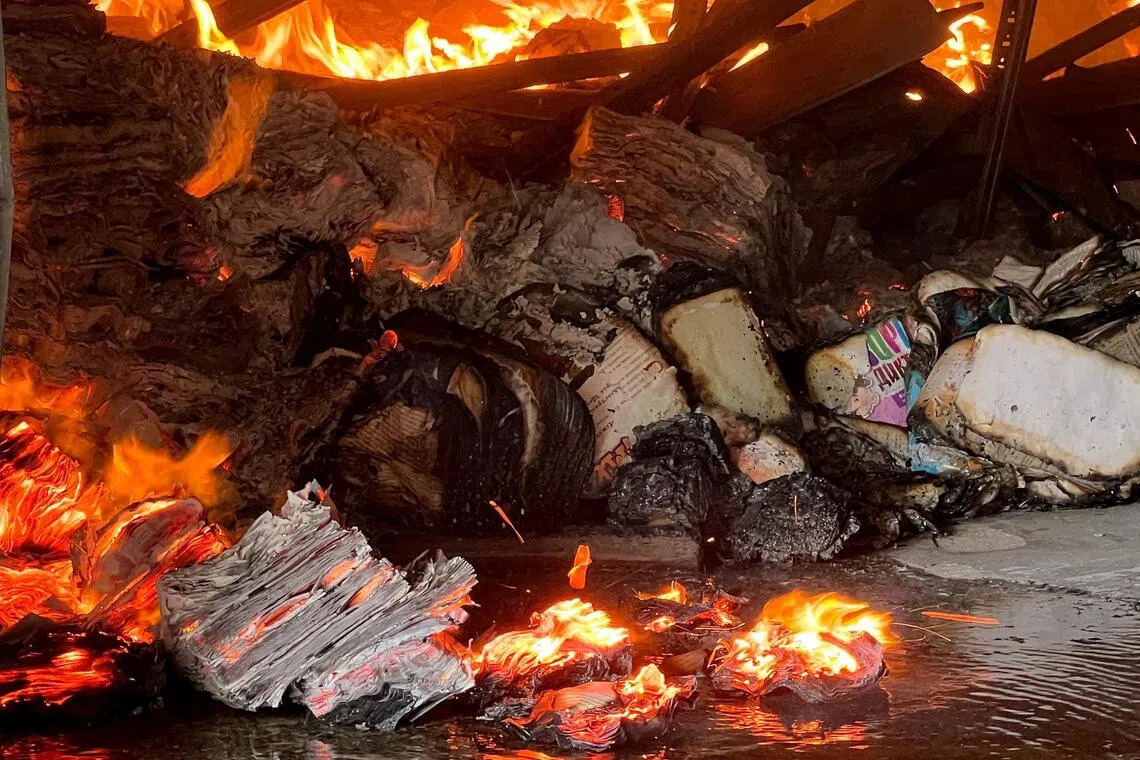 Millions of burnt books show how 'war of endurance' is hurting Ukraine