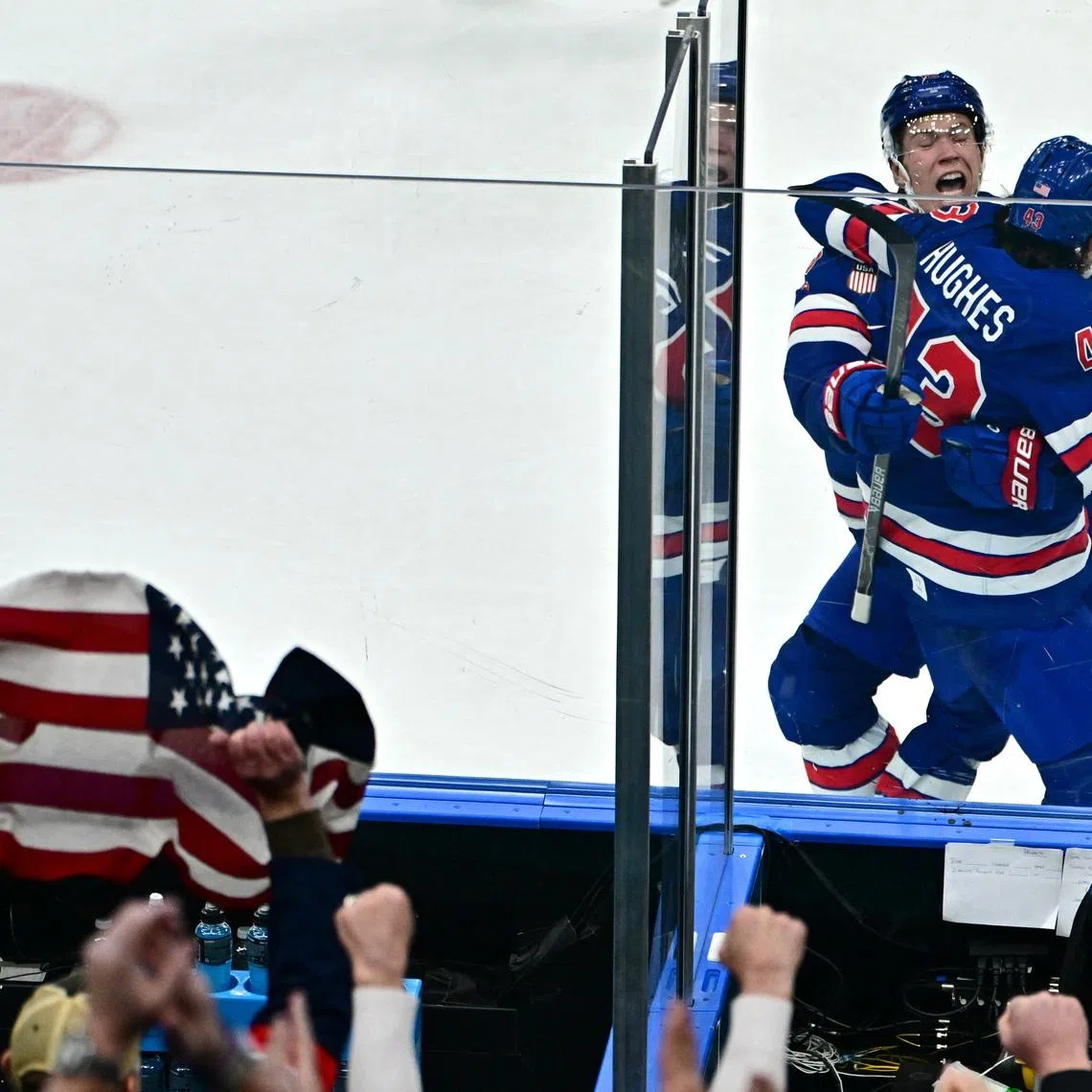 Milano Cortina 2026 Olympics - Ice Hockey - Men's Play-offs Quarterfinals - United States vs Sweden - Milano Santagiulia Ice Hockey Arena, Milan, Italy - February 18, 2026. Quinn Hughes of United States celebrates after scoring their second goal in overtime to win the match REUTERS/Marton Monus