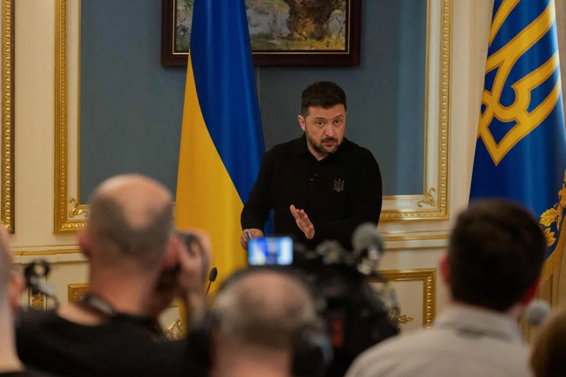 Ukraine's President Volodymyr Zelensky delivers a press conference in Kyiv on April 22, 2025, amid the Russian invasion of Ukraine. (Photo by Tetiana DZHAFAROVA / AFP)
