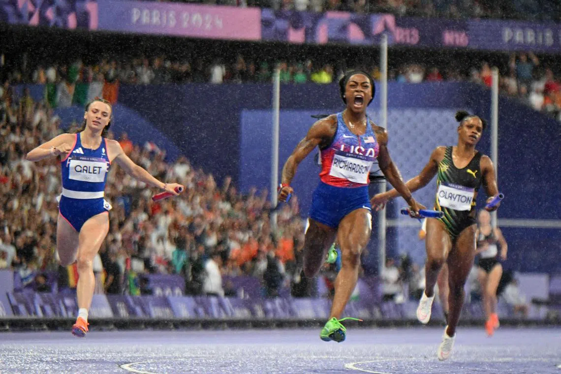 Sha'Carri Richardson (centre), of the US, crosses the finish line to win the women's 4x100m relay final, ahead of France's Chloe Galet and Jamaica's Tia Clayton.