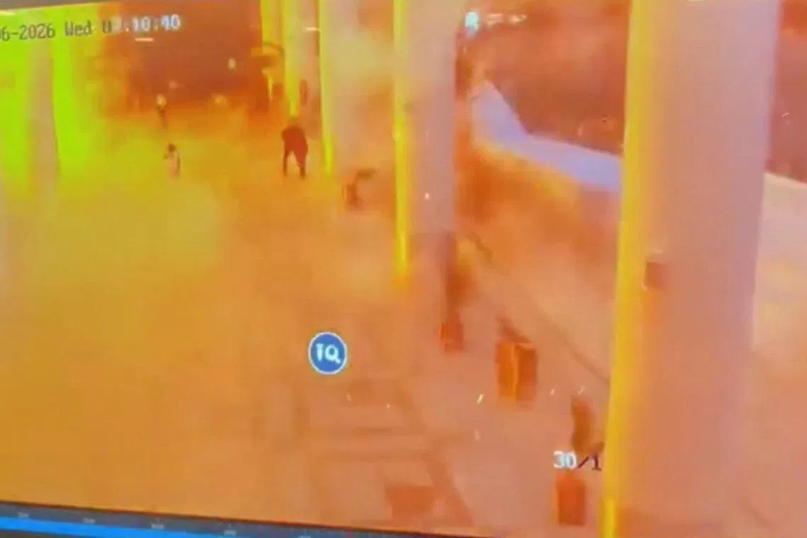 A CCTV footage shows people running for cover following a strike on Kuwait International Airport, in Kuwait City, Kuwait June 3, 2026. Civil Aviation Kuwait/Handout via REUTERS