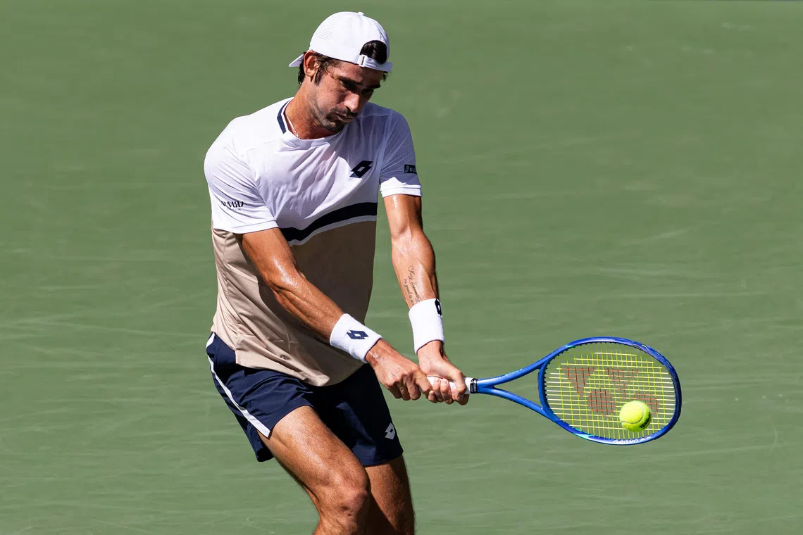 Aug 27, 2025; Flushing, NY, USA; Lloyd Harris of South Africa in action against Taylor Fritz of the United States in the second round of the men’s singles at the US Open at Louis Armstrong Stadium in Billie Jean King National Tennis Center. Mandatory Credit: Mike Frey-Imagn Images