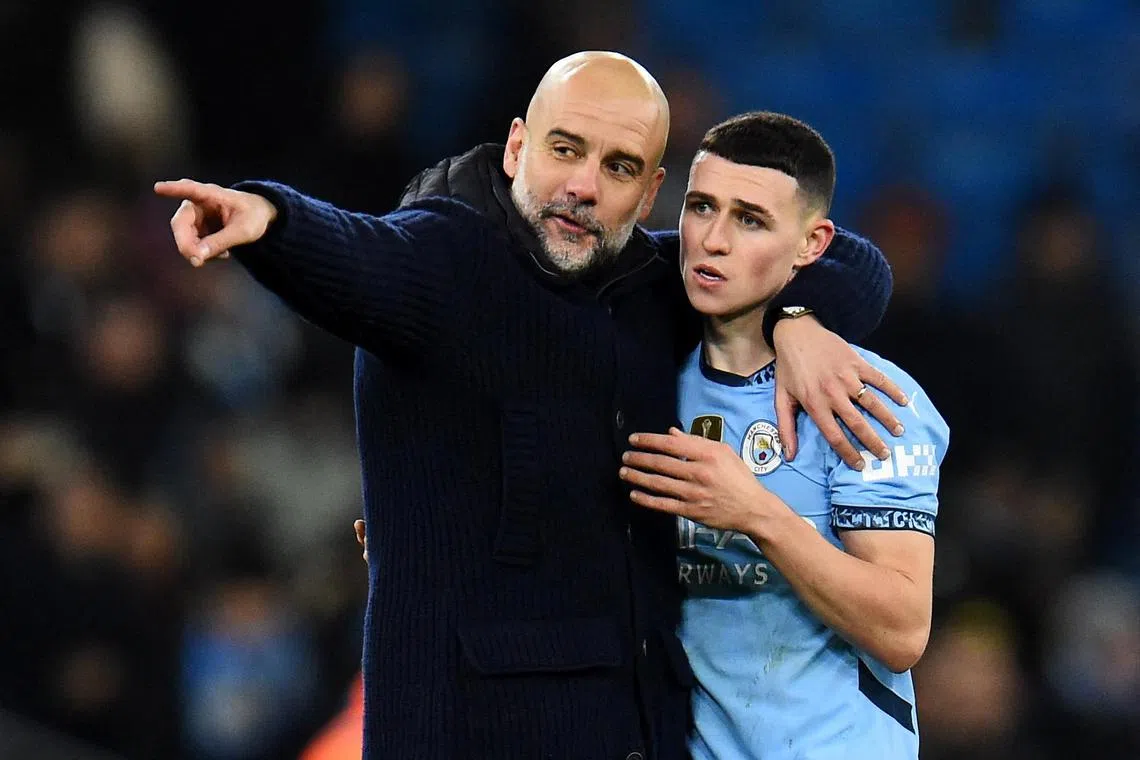 Manchester City manager Pep Guardiola and Phil Foden celebrating after the 3-1 English Premier League win over Chelsea at the Etihad on Jan 25.