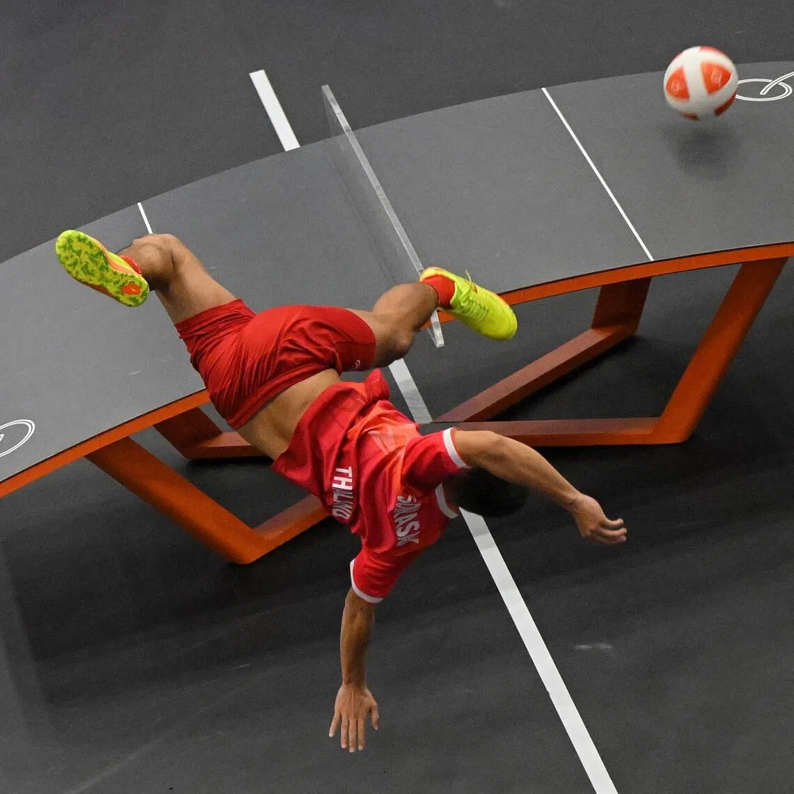 Sorrasak Thaosiri of Thailand in action against the team from Iraq during the teqball men’s doubles semifinals held at the Nagoya City Higashi Sports Centre on Sept 19.
