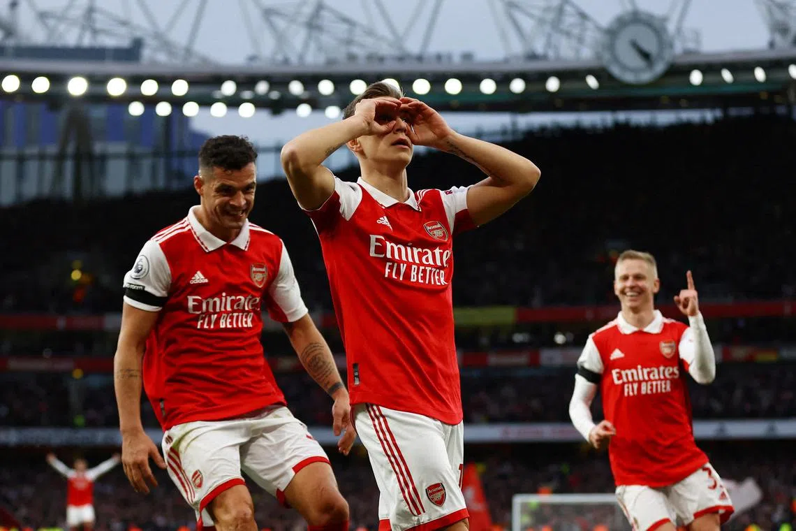 Leandro Trossard celebrates with Granit Xhaka after scoring for Arsenal.