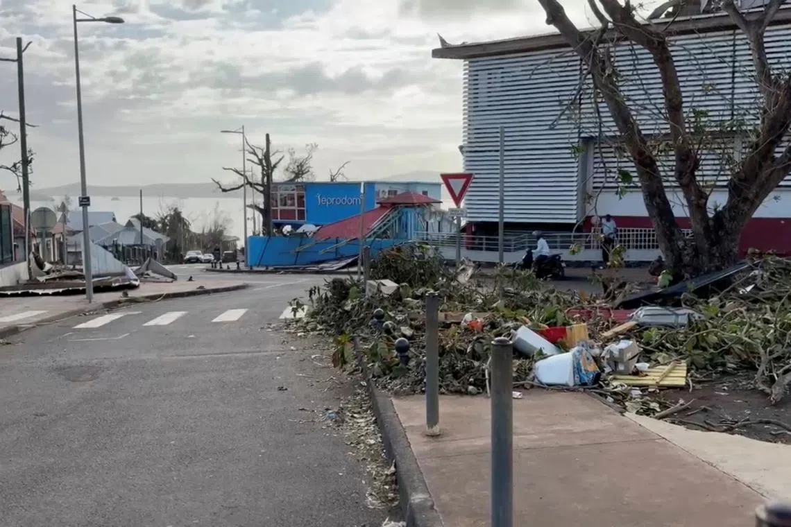 Torn branches lie on the ground following Cyclone Chido outside Mayotte Central Hospital in Mamoudzou, Mayotte, France December 16, 2024 in this still image taken from video obtained by REUTERS