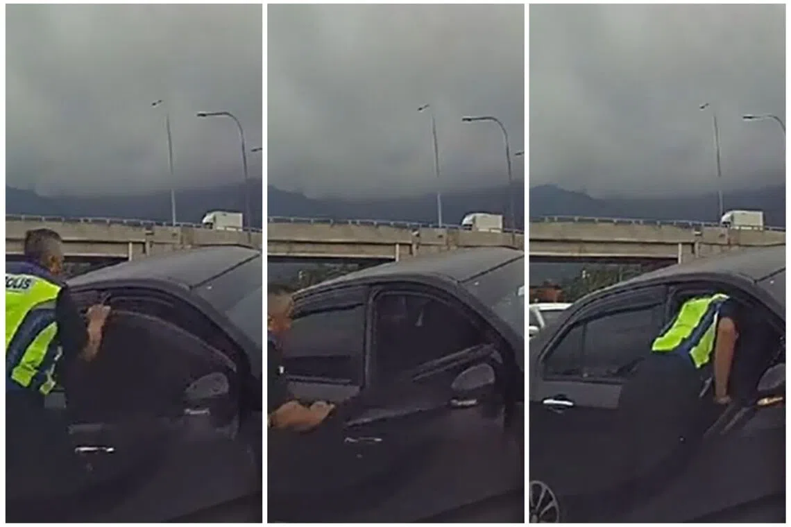 A police officer pulled and bent the door downwards to create a gap.