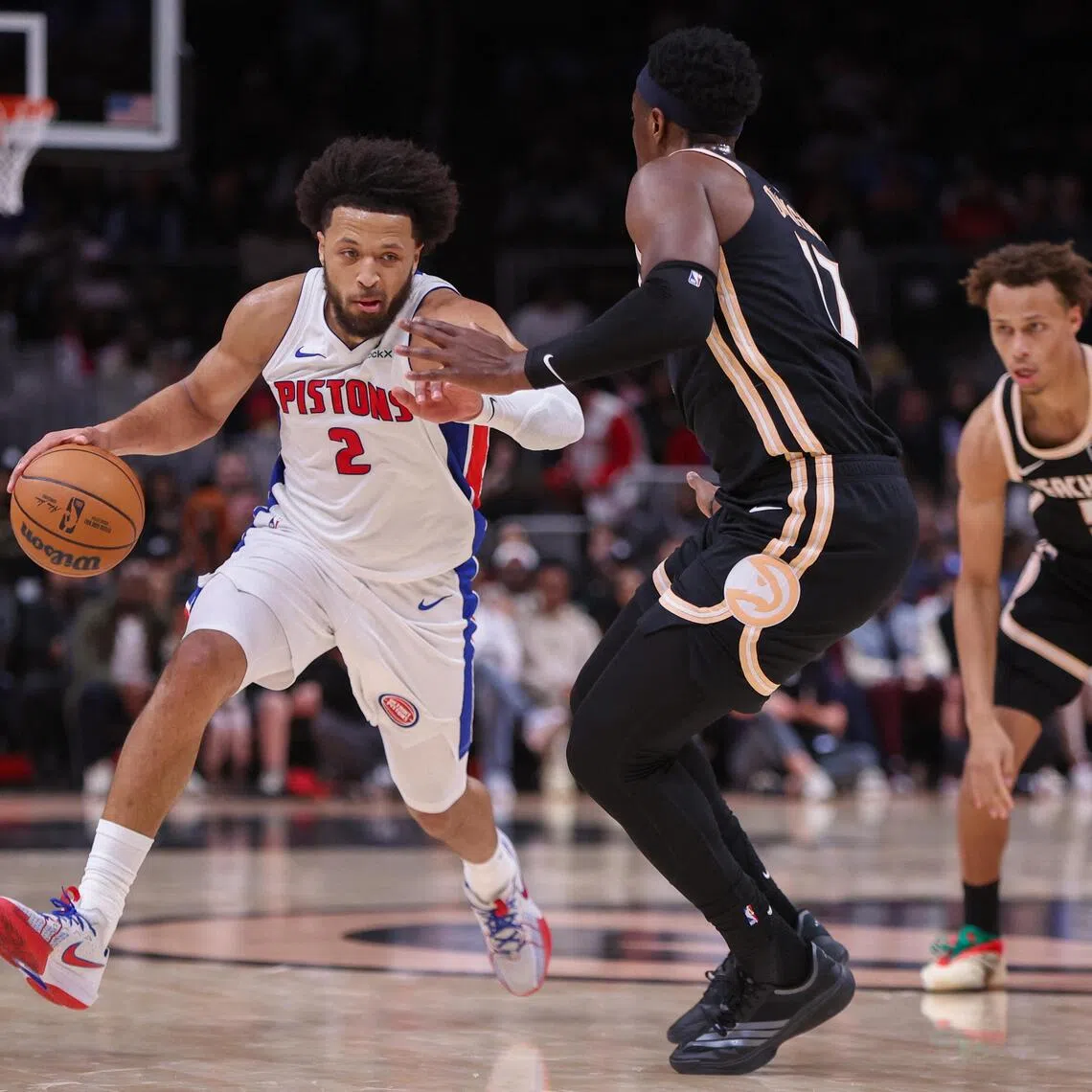 Detroit Pistons guard Cade Cunningham drives on Atlanta Hawks forward Onyeka Okongwu in the second quarter at State Farm Arena.