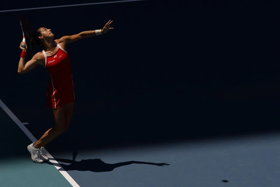 FILE PHOTO: Mar 21, 2025; Miami, FL, USA; Caroline Garcia (FRA) serves against Iga Swiatek (POL) on day four of the Miami Open at Hard Rock Stadium. Mandatory Credit: Geoff Burke-Imagn Images/File Photo