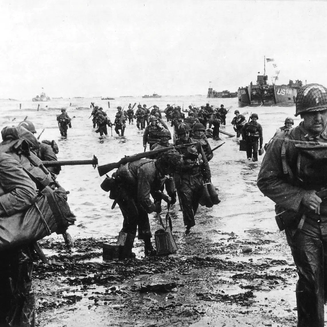 FILE PHOTO: U.S. reinforcements land on Omaha beach during the Normandy D-Day landings near Vierville sur Mer, France, on June 6, 1944 in this handout photo provided by the U.S. National Archives. Cpt Herman Wall/U.S. National Archives/Handout via Reuters/File Photo