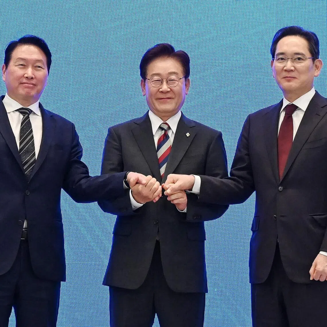 South Korean President Lee Jae Myung (centre) with SK Group chairman Chey Tae-won (left) and Samsung Electronics chairman Lee Jae-yong after an announcement of public-private collaboration projects in Seoul on June 29.