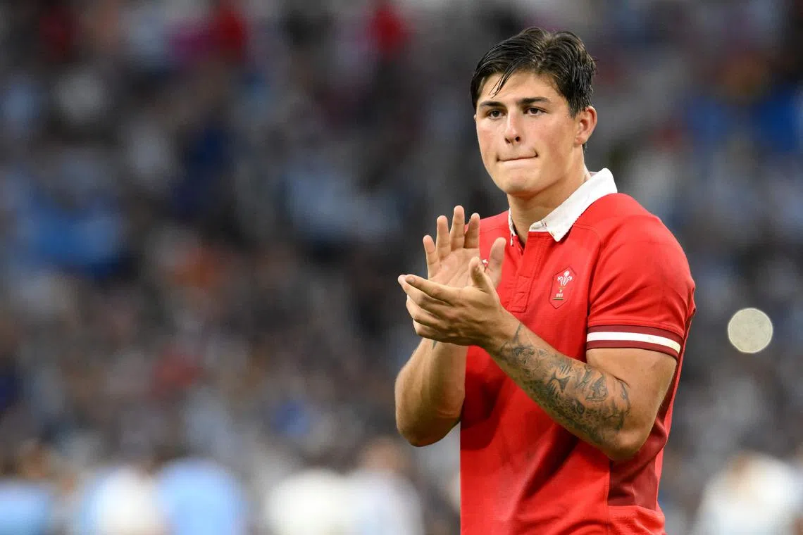 Wales right wing Louis Rees-Zammit applaud their fans after defeat by Argentina in their Rugby World Cup quarter-final at the Stade Velodrome in Marseille on Oct 14, 2023.