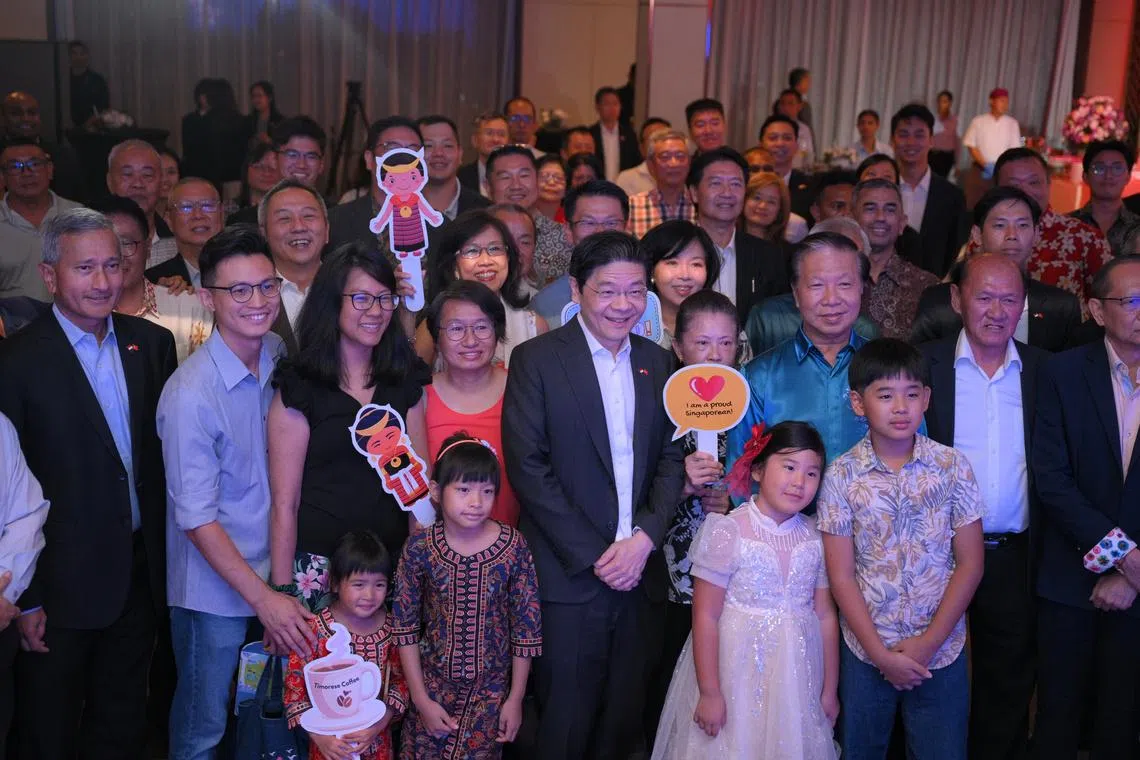 Prime Minister Lawrence Wong and Foreign Minister Vivian Balakrishnan taking a group photo with Singaporeans based in Timor-Leste on July 2.