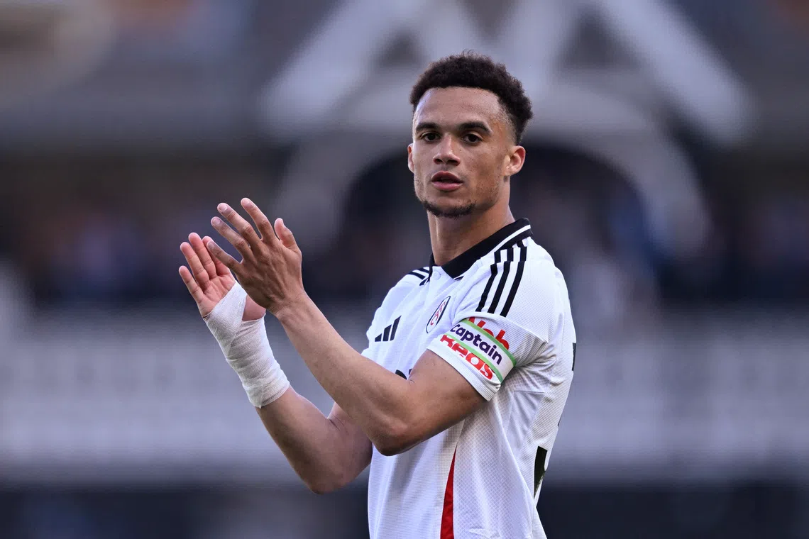 Soccer Football - Premier League - Fulham v Liverpool - Craven Cottage, London, Britain - April 6, 2025 Fulham's Antonee Robinson celebrates after the match REUTERS/Tony O Brien