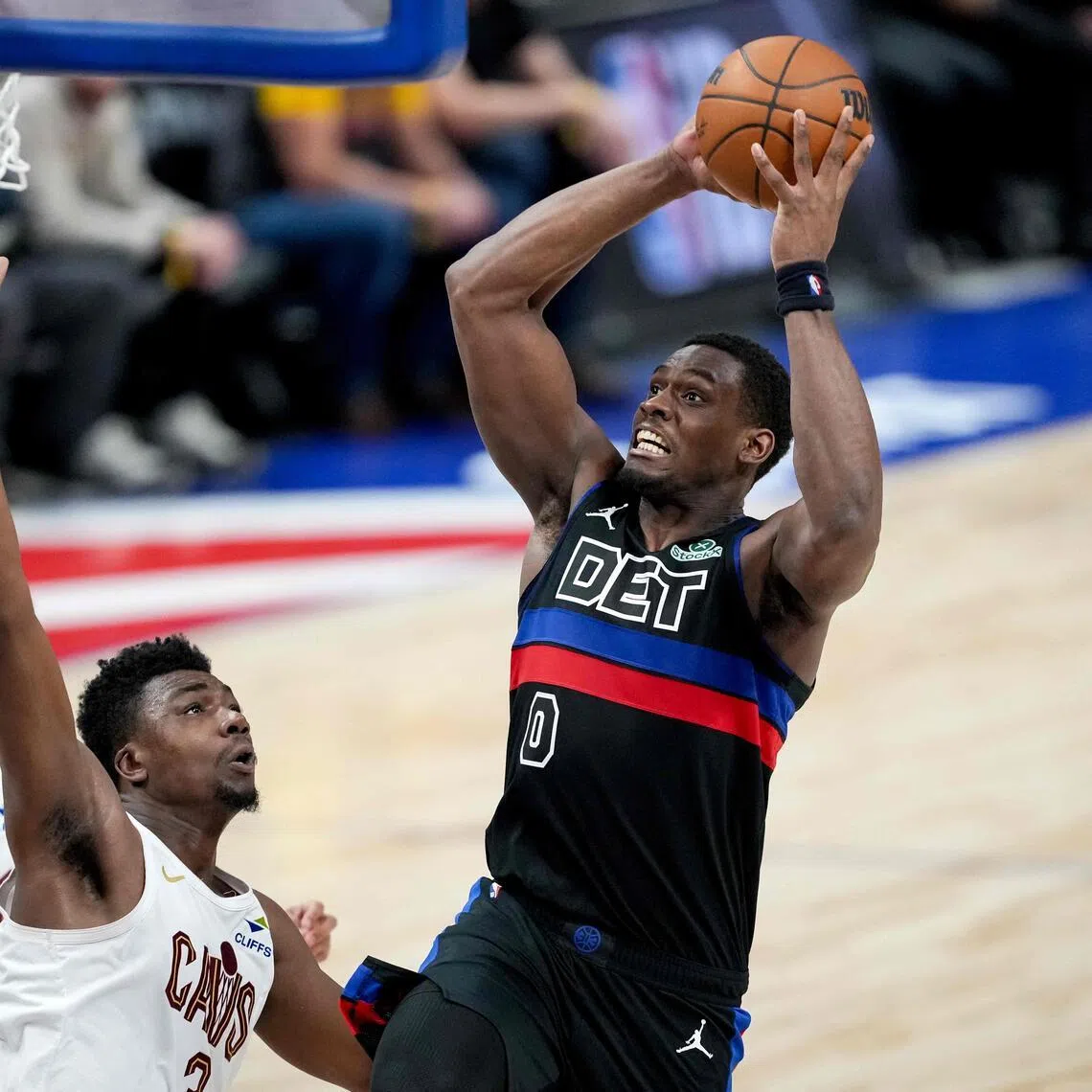 Jalen Duren of the Detroit Pistons shoots the ball against Thomas Bryant of the Cleveland Cavaliers during the fourth quarter at Little Caesars Arena.
