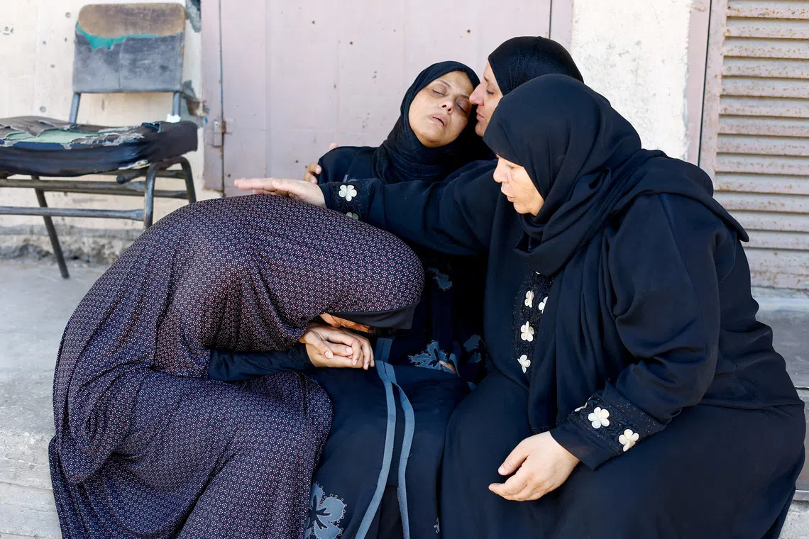 Mother of three-year-old Palestinian child Tayyem Hamdan, who was killed in an Israeli strike according to medics at Al-Aqsa Martyrs Hospital in Deir al-Balah, reacts during his funeral in central Gaza Strip, August 30, 2026. REUTERS/Mahmoud Issa