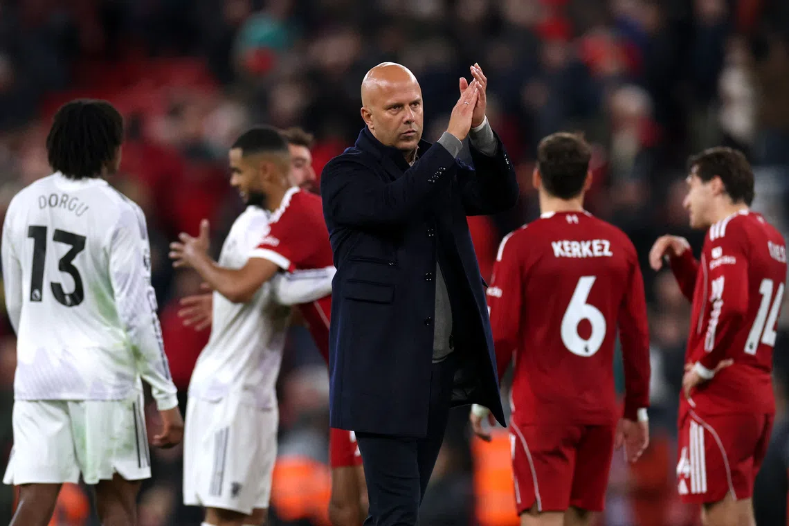 Soccer Football - Premier League - Liverpool v Manchester United - Anfield, Liverpool, Britain - October 19, 2025 Liverpool manager Arne Slot applauds fans after the match REUTERS/Phil Noble