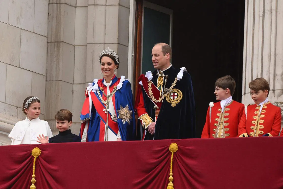 (From left) Britain's Princess Charlotte of Wales, Prince Louis of Wales, Catherine, Princess of Wales, William, Prince of Wales, and Britain's Prince George of Wales on the Buckingham Palace balcony.