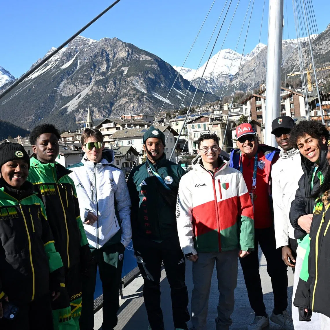 Milano Cortina 2026 Winter Olympics - Stadium, City, Italy - Month Day, 2026 A group of skiers from Jamaica, South Africa, Eritrea, Madagascar, Benin and Kenya stand together ahead of the alpine skiing slalom race at the Milano Cortina 2026 Winter Olympics, in Bormio,Italy - February 15, 2026 REUTERS/ Angelika Warmuth
