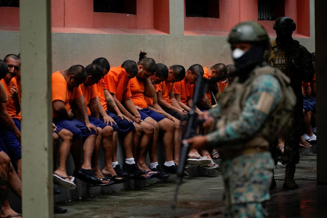 FILE PHOTO: Inmates in cell block 3 bow their head as they listen to a soldier at the militarized Litoral prison,as part of the measures taken by Ecuador's President Daniel Noboa to crackdown on gangs, during a media tour in Guayaquil, Ecuador, February 9, 2024. REUTERS/Santiago Arcos/File Photo