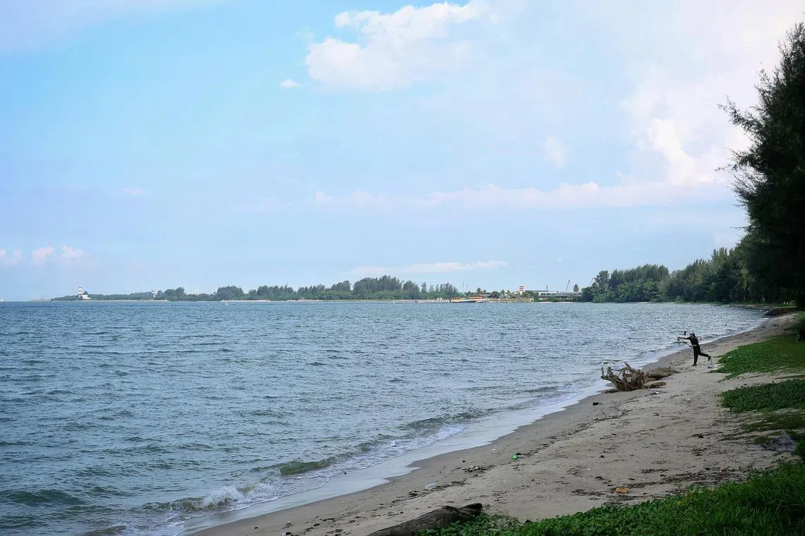 The estimated 193ha of land off Changi (in the distant horizon starting from the shore off Changi Beach carpark 7 on the right to Changi Exhibition Centre on the left), which will be reclaimed for the development of the aviation park, as seen from the coast near Changi Beach carpark 6 on July 3, 2025. slug: aqchangi03