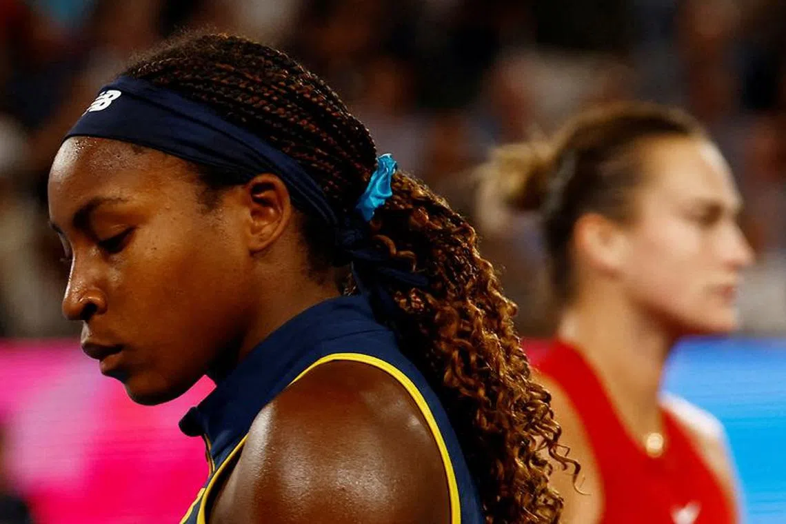 Tennis - Australian Open - Melbourne Park, Melbourne, Australia - January 25, 2024 Coco Gauff of the U.S. and Belarus' Aryna Sabalenka during their semi final match  REUTERS/Issei Kato