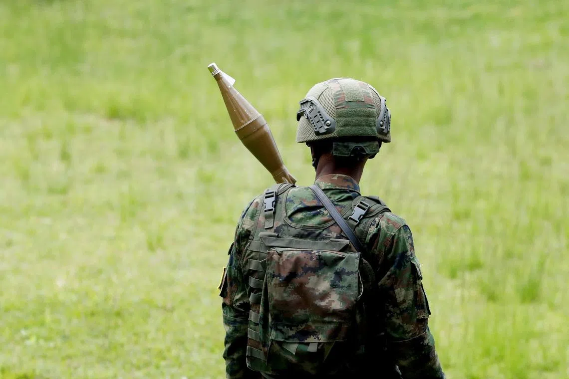 A Rwanda Defence Force (RDF) soldier stands in position at the Grande Barrier border amid clashes between M23 the Armed Forces of the Democratic Republic of the Congo (FARDC), at the border crossing point at Gisenyi, in Rubavu district, Rwanda, January 29, 2025. REUTERS/Thomas Mukoya