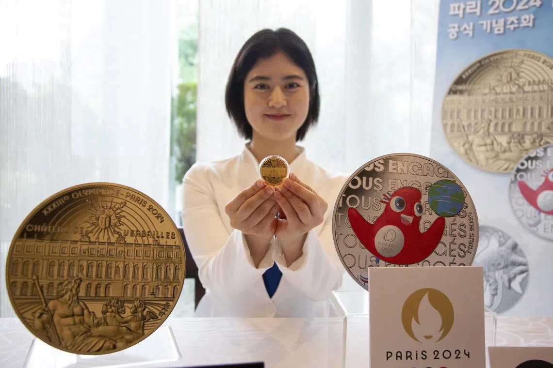 A model showing commemorative coins for the 2024 Paris Summer Olympics, made by Monnaie de Paris, at the French Embassy in Seoul on June 7, 2023.