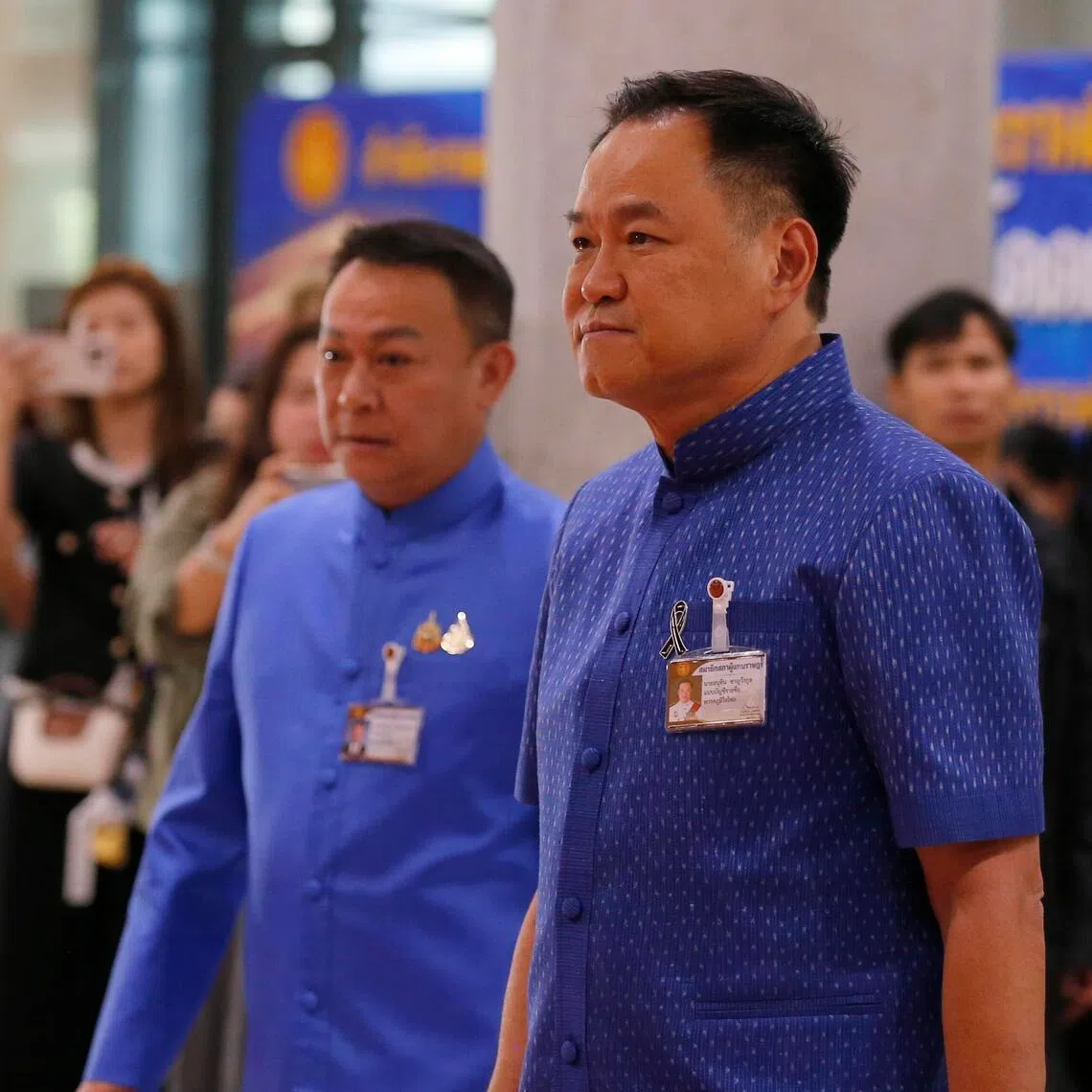 Thai caretaker Prime Minister and Bhumjaithai Party's leader Anutin Charnvirakul (right) arriving for the first meeting to vote for the new Speaker of the House of Representatives of Parliament, in Bangkok on March 15, 2026. 