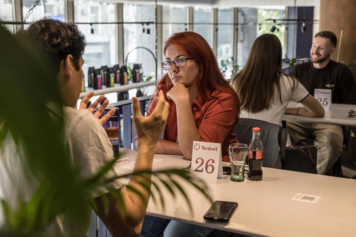 People at a TetAteT speed dating session in Kyiv, Ukraine on July 21, 2024.
