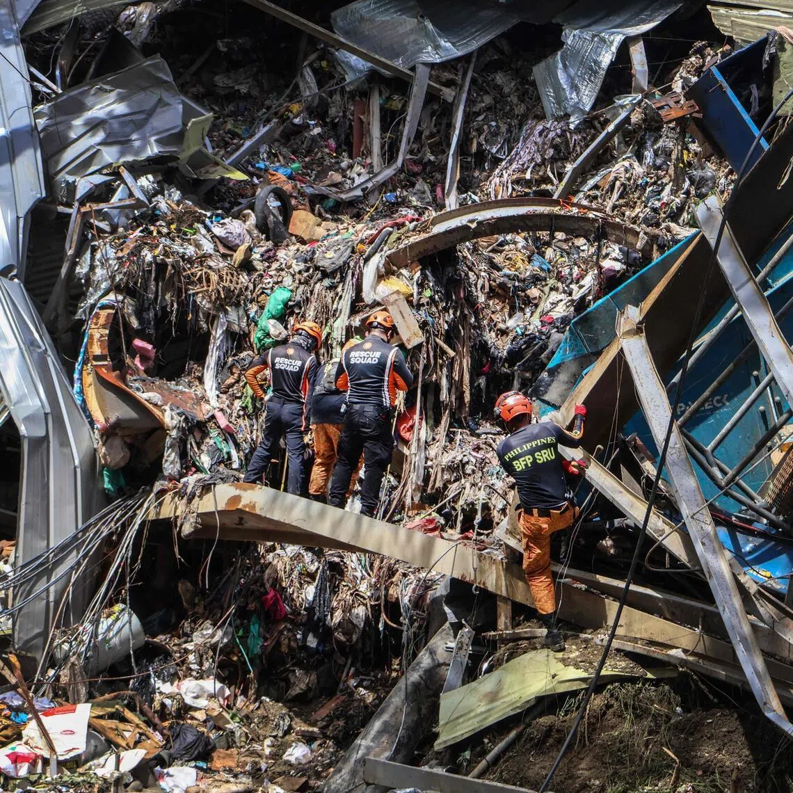 Members of the search and rescue team look for people after a landslide at the landfill in Barangay Binaliw, Cebu City on Jan 11, 2026.