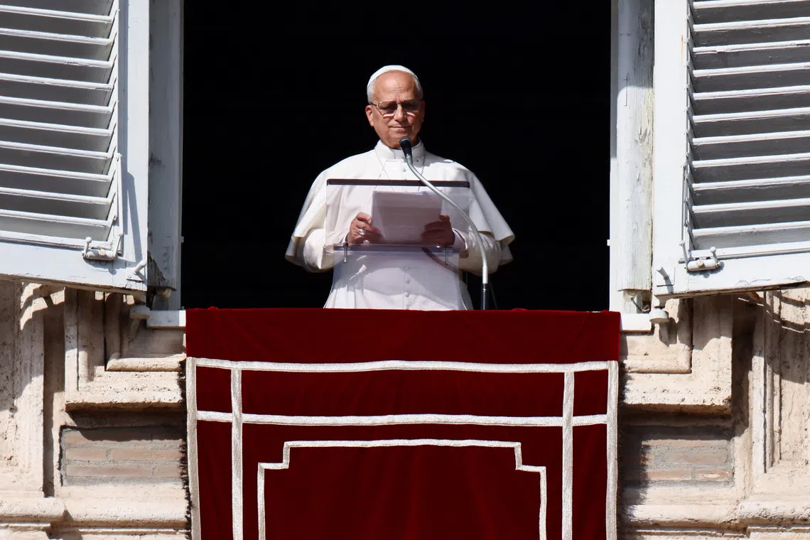 Pope Leo XIV leads the Angelus prayer from the window of the Apostolic Palace at the Vatican, November 2, 2025. REUTERS/Vincenzo Livieri