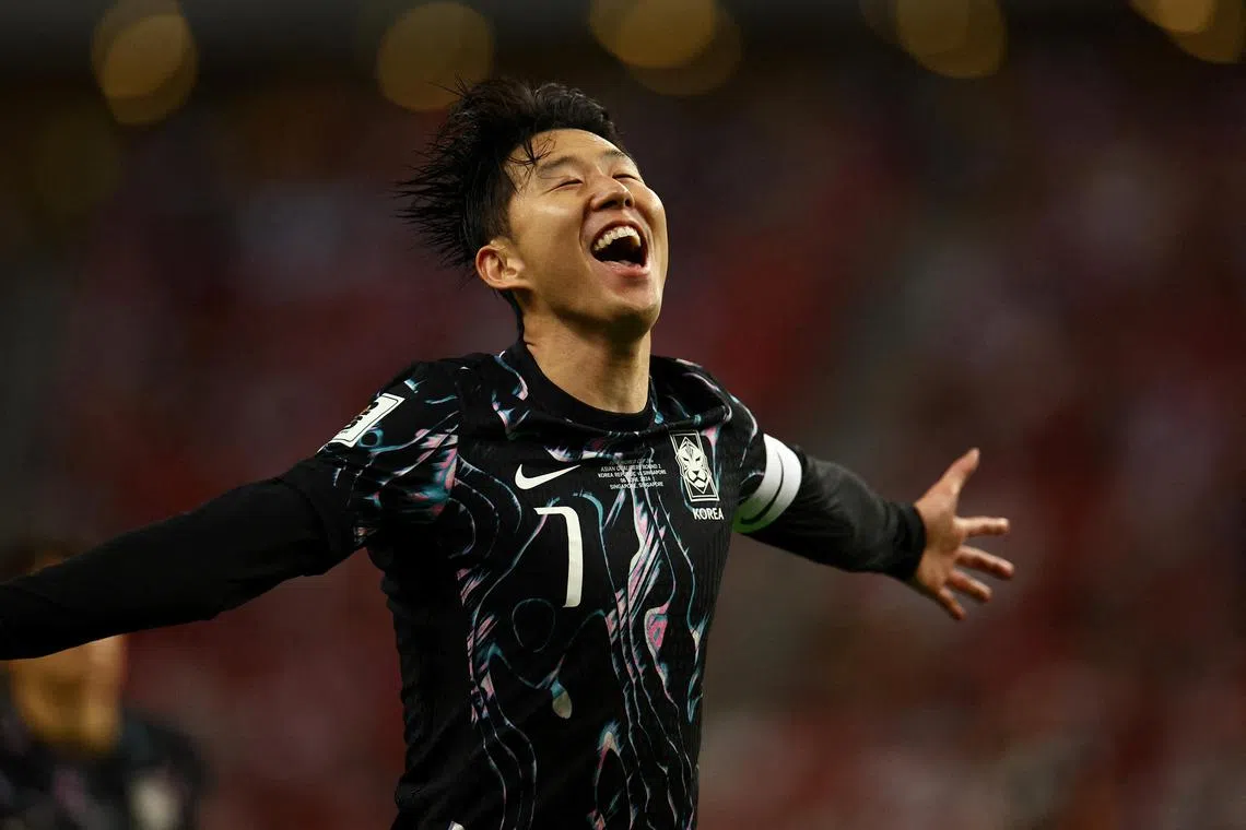 South Korea's Son Heung-min celebrates scoring their fifth goal in the 7-0 thrashing of Singapore.