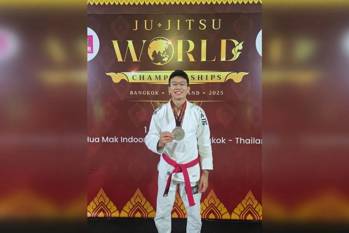 Singapore's Noah Lim posing with the silver medal that he won at the Ju-jitsu International Federation World Championships on Nov 4.