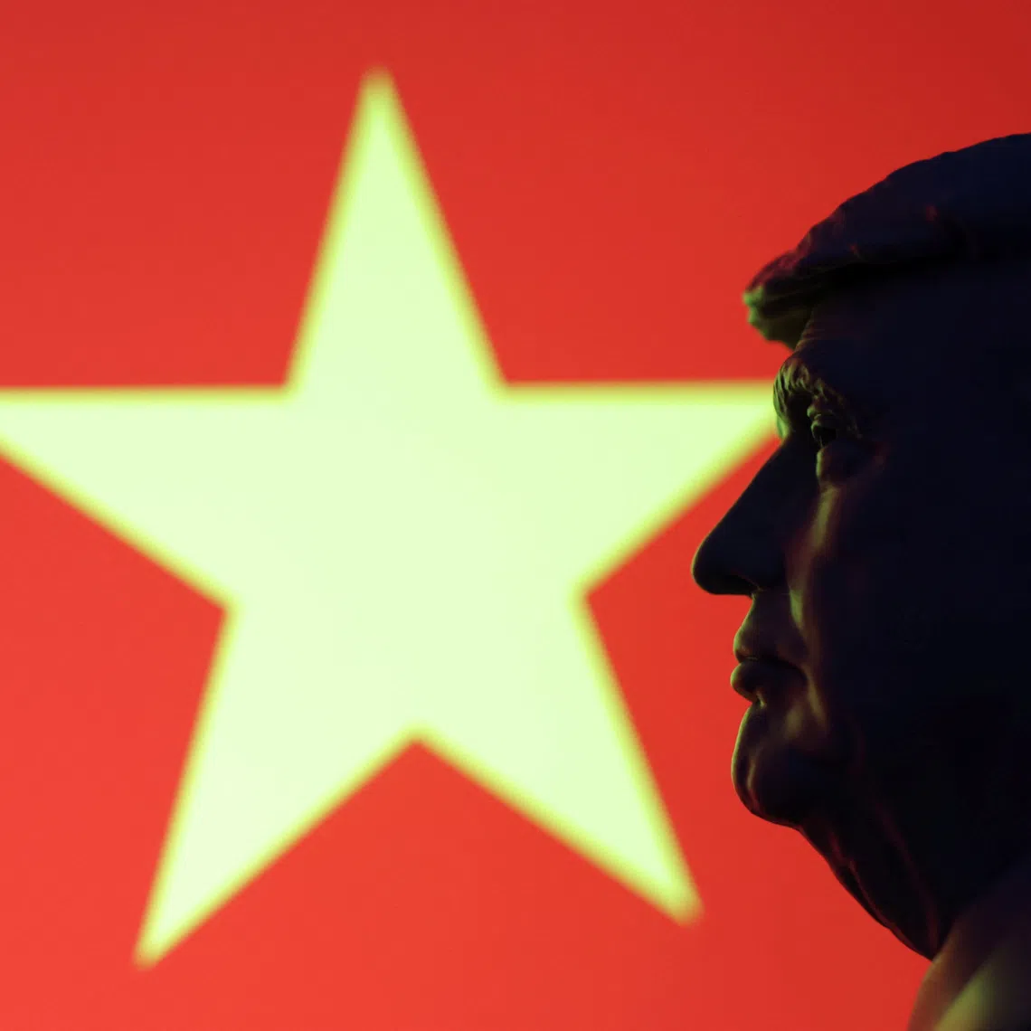 A 3D-printed miniature model of U.S. President Donald Trump and the Vietnam flag are seen in this illustration taken July 23, 2025. REUTERS/Dado Ruvic/Illustration