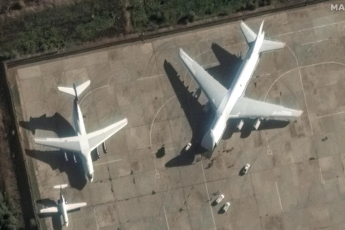 A satellite image shows an AN-124 heavy transport aircraft with its nose cone lifted, at Hmeimim air base in Syria’s coastal Latakia province.