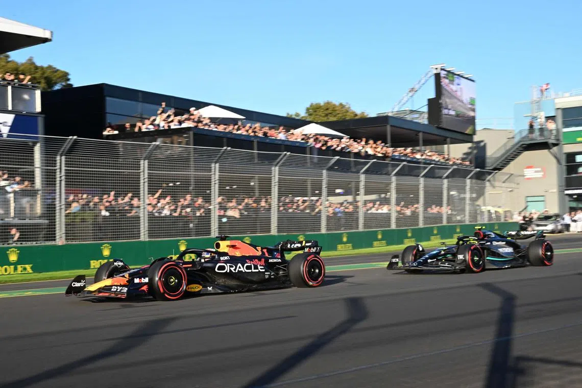 Red Bull Racing's Dutch driver Max Verstappen leading Mercedes' British driver Lewis Hamilton during a restart at the Australian Grand Prix.