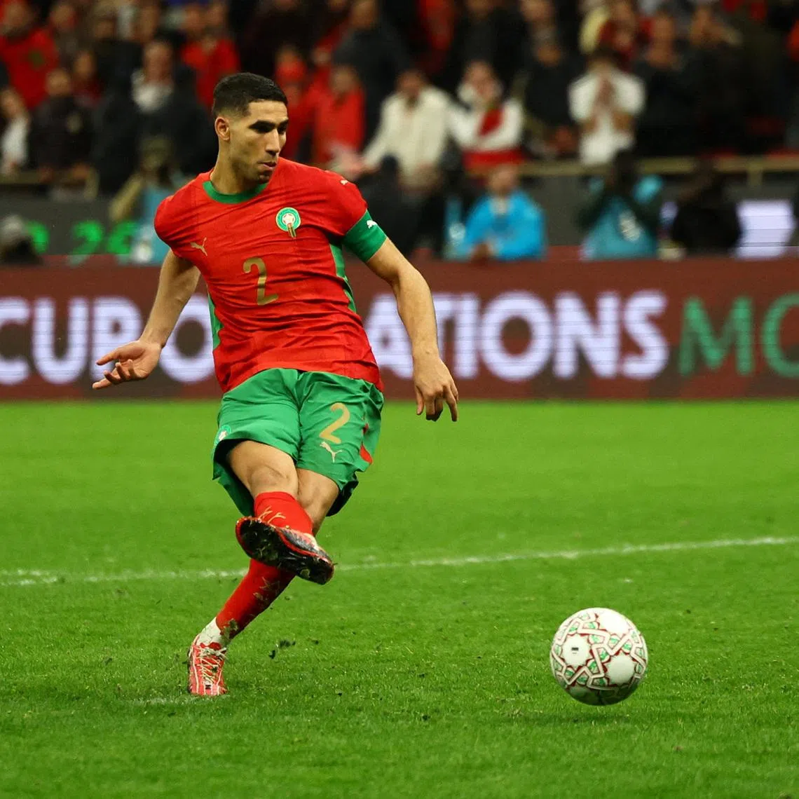 Soccer Football - CAF Africa Cup of Nations - Morocco 2025 - Semi Final - Nigeria v Morocco - Prince Moulay Abdellah Stadium, Rabat, Morocco - January 14, 2026 Morocco's Achraf Hakimi scores his penalty during a penalty shootout REUTERS/Siphiwe Sibeko