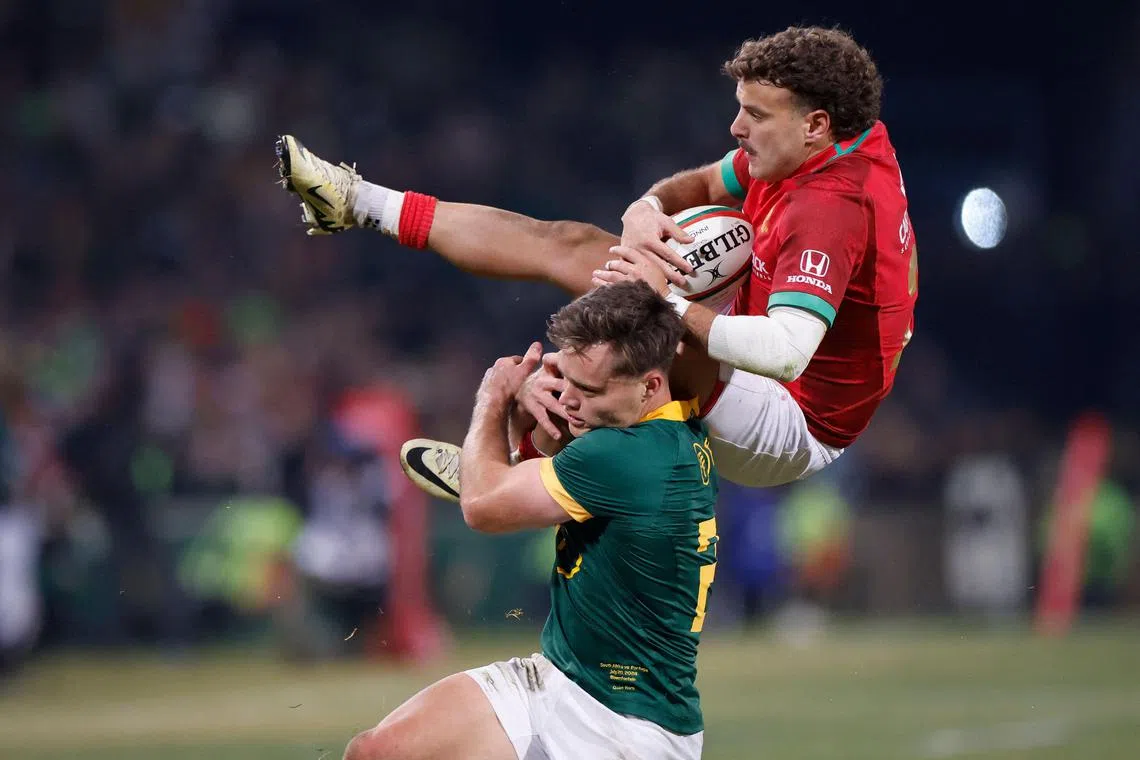 Portugal's Jose Paiva dos Santos is tackled by South Africa's Quan Horn during the International rugby union match in Bloemfontein on July 20, 2024. 