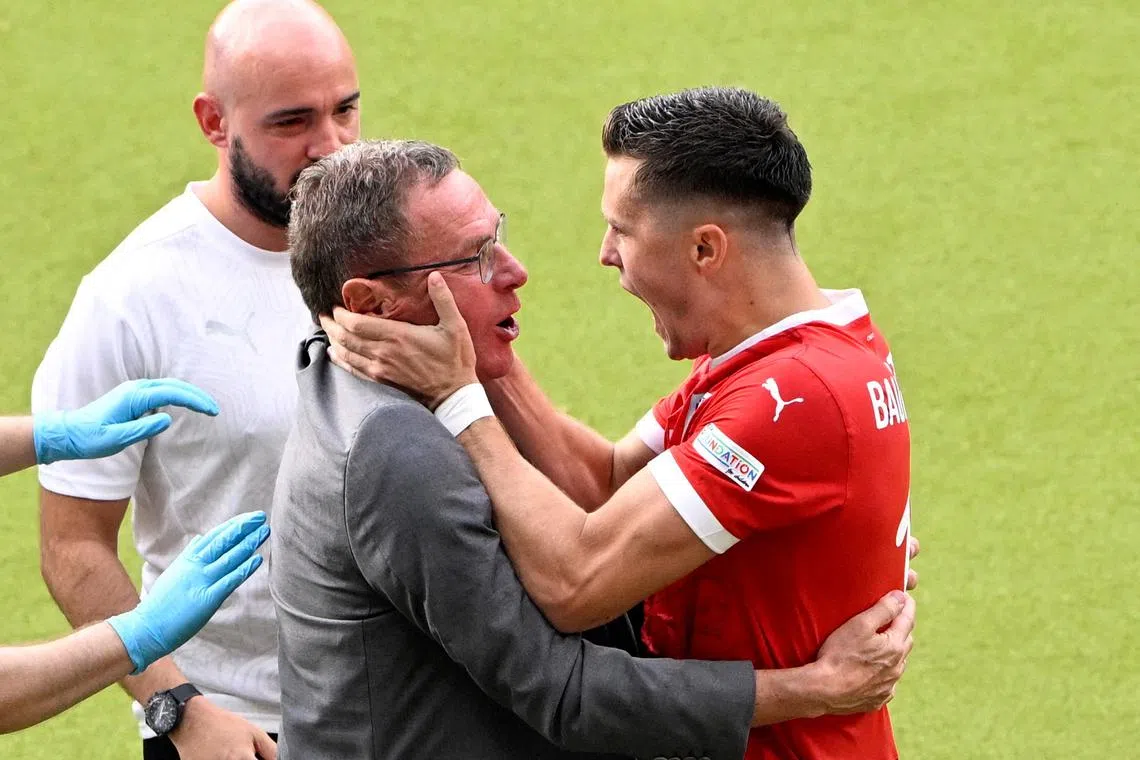 Soccer Football - Euro 2024 - Group D - Poland v Austria - Berlin Olympiastadion, Berlin, Germany - June 21, 2024 Austria's Christoph Baumgartner celebrates scoring their second goal with coach Ralf Rangnick REUTERS/Fabian Bimmer