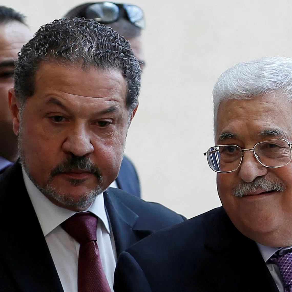 Palestinian President Mahmoud Abbas, accompanied by his son Yasser, leaves a hospital in Ramallah in the Israeli-occupied West Bank, May 28, 2018. REUTERS/Mohamad Torokman/File Photo