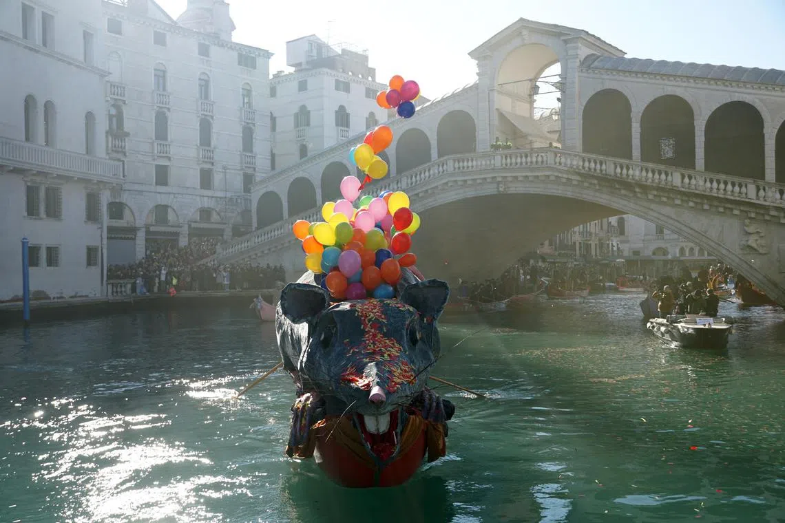 The Pantegana boat in the shape of a giant rat leading the procession of boats, with rowers dressed in imaginative and bright costumes, during the Pantegana Regatta on the Grand Canal, kicking off the 2024 edition of the Venetian Carnival, in Venice, Italy, Jan 28, 2024. 