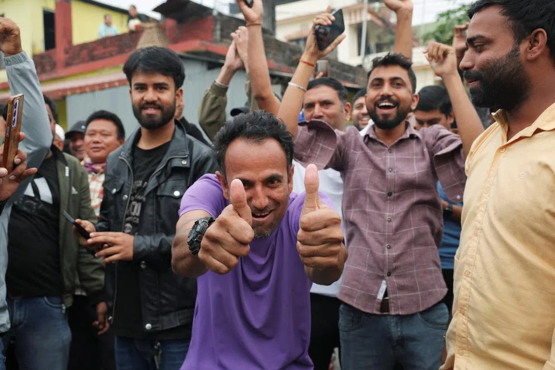 Supporters of Rastriya Swatantra Party (RSP) celebrate after election officials announce that Balendra Shah, a rapper-turned-politician and the prime ministerial candidate for RSP, is leading, outside a counting centre in Damak, Jhapa district, Nepal, March 7, 2026. REUTERS/Adnan Abidi