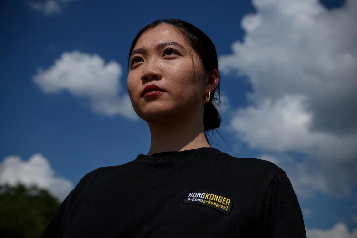 FILE PHOTO: Anna Kwok, 26, a Washington D.C. based Hong Kong activist, who has been designated by the Hong Kong police as a fugitive with a $1 million Hong Kong dollars bounty offered for her arrest, is photographed near the White House in Washington, DC, U.S., July 10, 2023. REUTERS/Evelyn Hockstein/File Photo