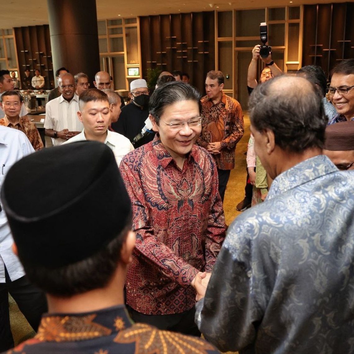 Prime Minister Lawrence Wong interacting with community leaders during the annual MHA Appreciation Lunch for community volunteers at Parkroyal Collection Marina Bay, on Sept 13.