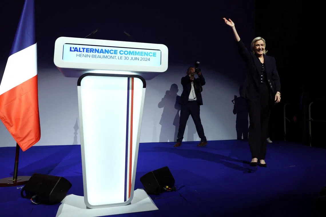 Marine Le Pen, French far-right leader and far-right Rassemblement National (National Rally - RN) party candidate, reacts on stage after partial results in the first round of the early French parliamentary elections in Henin-Beaumont, France, June 30, 2024. REUTERS/Yves Herman