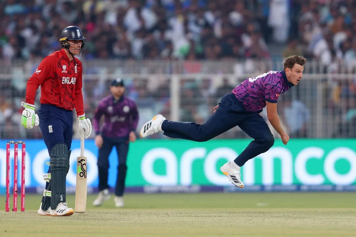 Cricket - ICC Men's T20 World Cup 2026 - Group C - England v Scotland - Eden Gardens, Kolkata, India - February 14, 2026 Scotland's Brad Wheal in action as England's Tom Banton looks on REUTERS/Sahiba Chawdhary