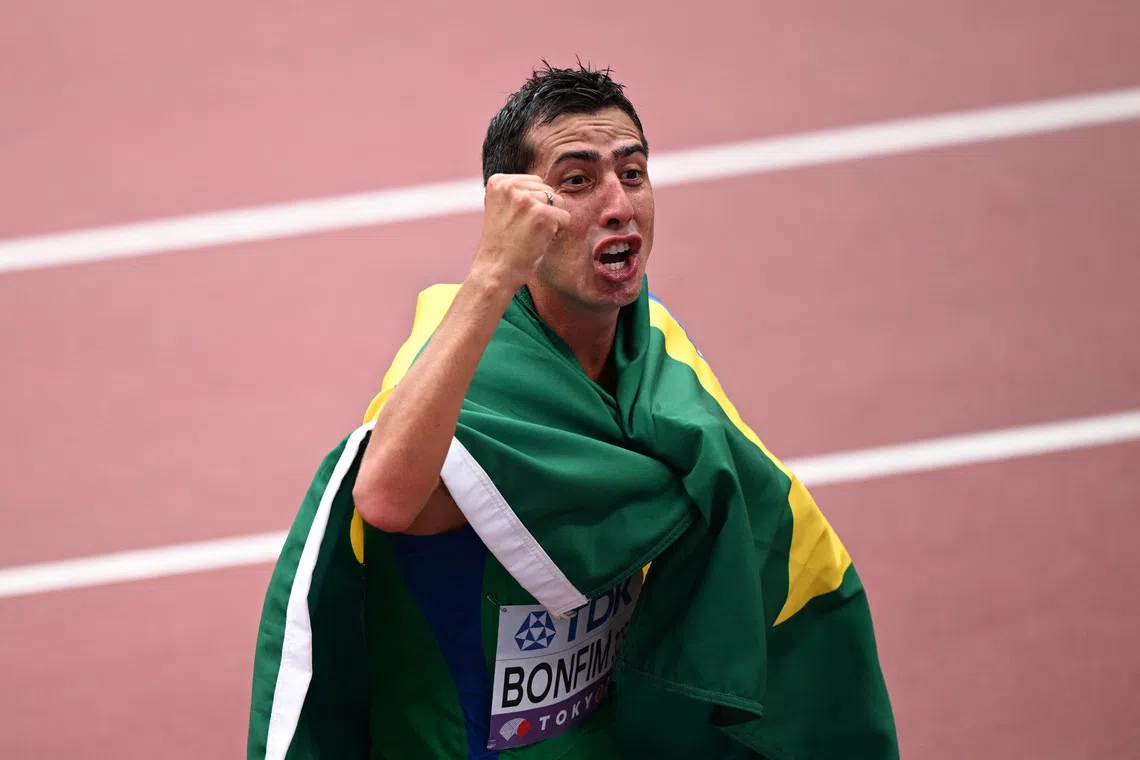 World Athletics Championships Tokyo 2025 - Men's 20km Race Walk Final - Japan National Stadium, Tokyo, Japan - September 20, 2025 Brazil's Caio Bonfim celebrates after winning the Men's 20km Race Walk Final REUTERS/Dylan Martinez