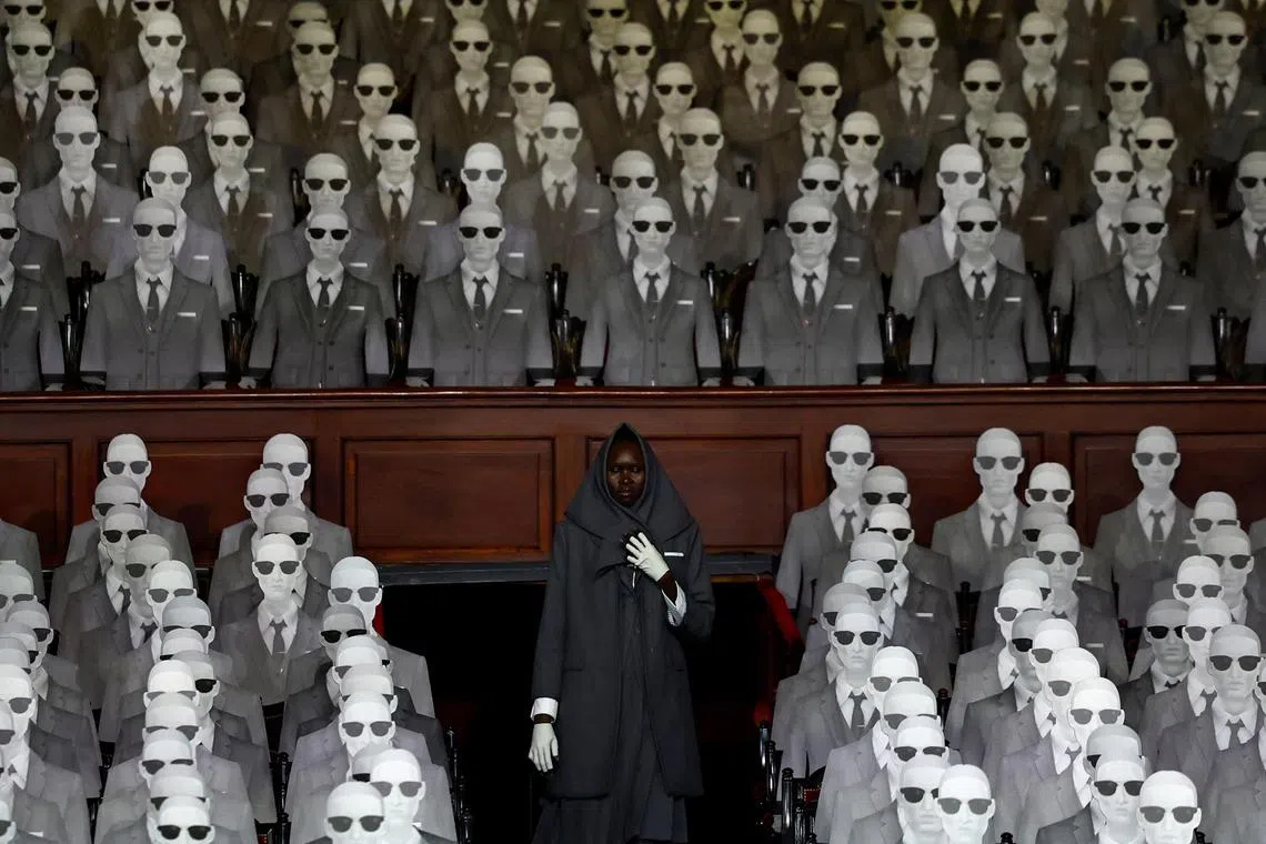 Model Alek Wek presenting  a creation by designer Thom Browne as part of his Haute Couture Fall/Winter 2023-2024 collection show at the Opera Garnier in Paris, France on July 3, 2023. 