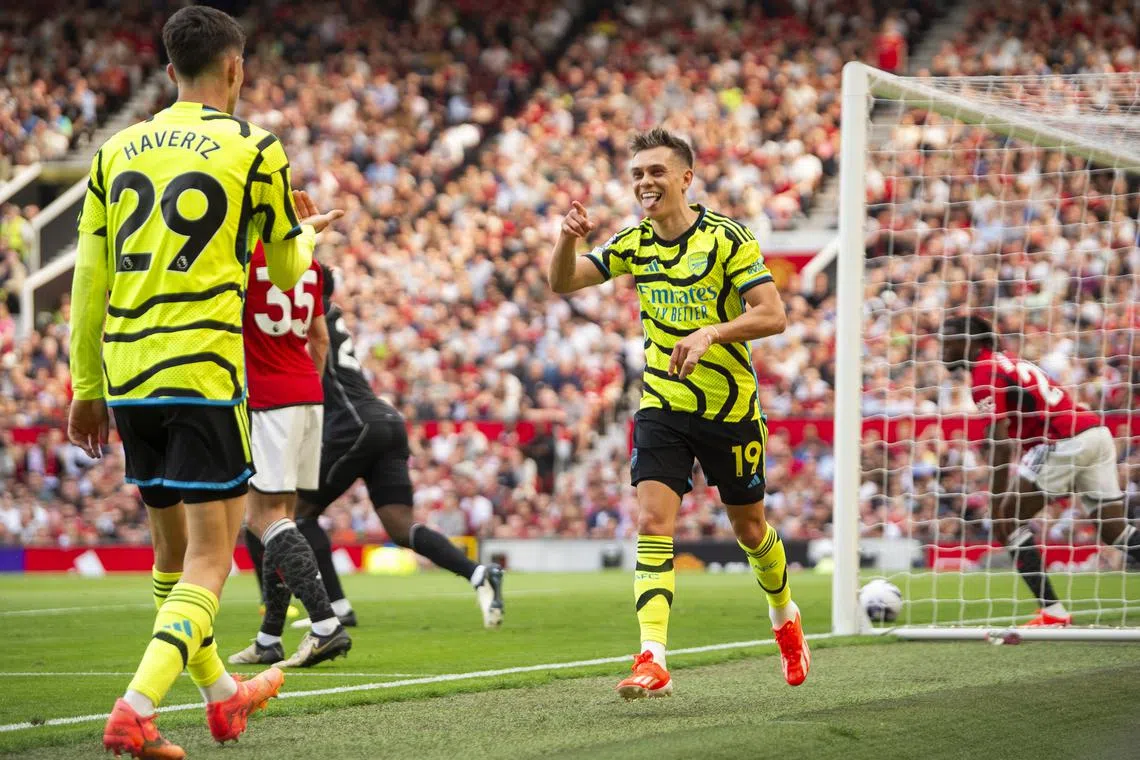 Leandro Trossard of Arsenal celebrates scoring the 0-1 goal with his teammtae Kai Havertz (left) who assisted the goal.